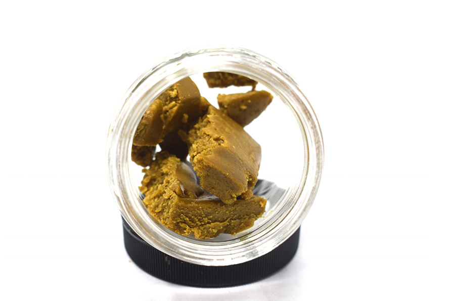 High quality budder weed concentrate in a glass bowl from chronic farms online dispensary and mail order marijuana weed store.