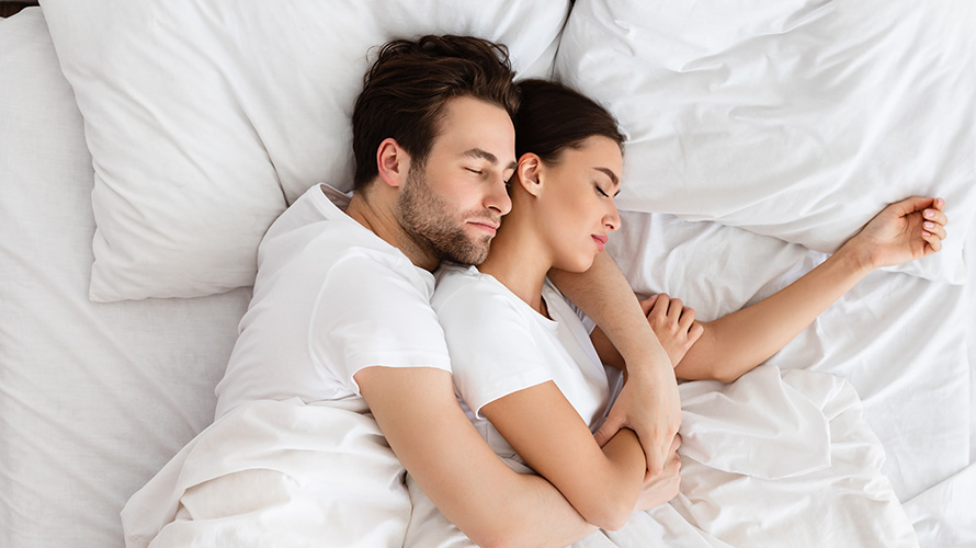 Couple sleeping well after buying marijuana for insomnia from an online dispensary in Canada for mail order marijuana dispensary weed.