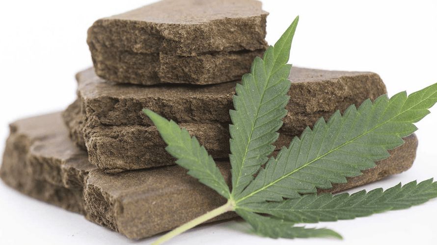 Hash, short for hashish, is a solid weed concentrate made by collecting, processing, and compressing trichomes to form a reddish-brown brick-like consistency.